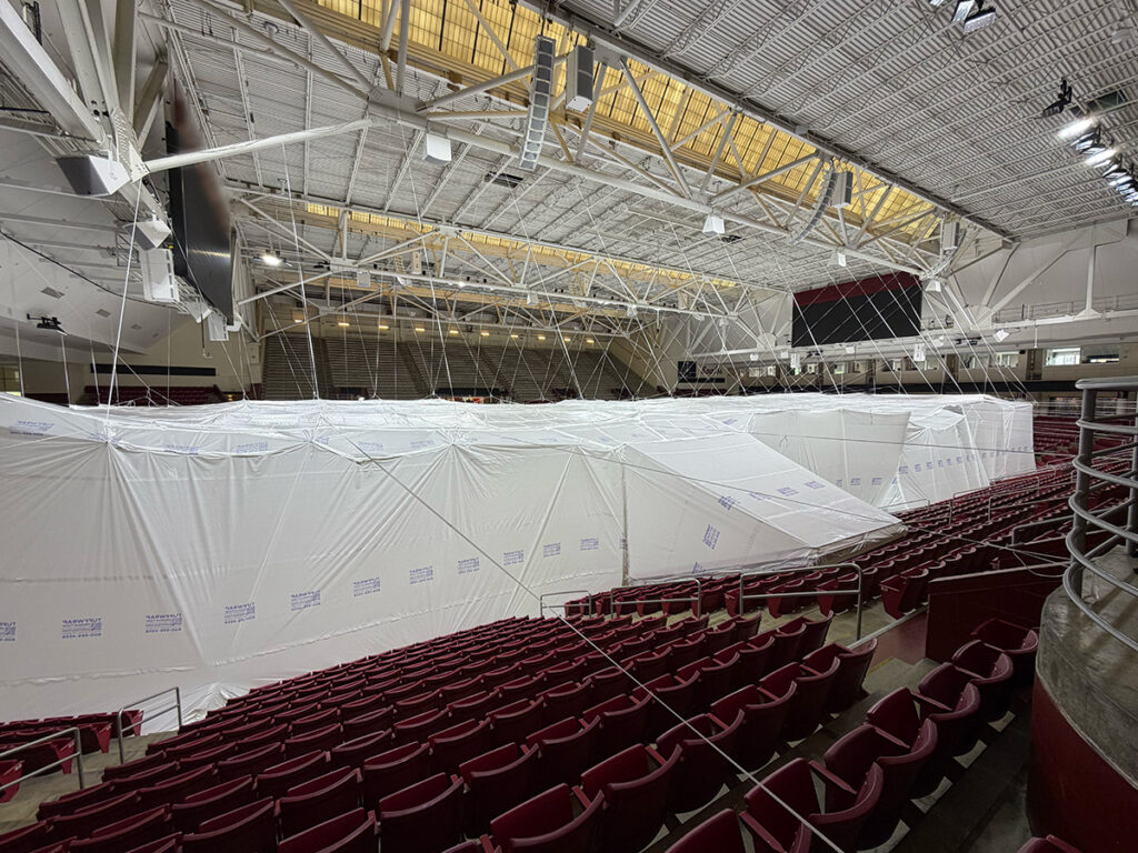 a total enclosure containing the floor of an area so that they could demo the current floor and install a new one without harming the seats